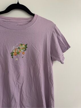 Mogul Moves Purple Lavender Graphic Tee with Orange Floral Motif
